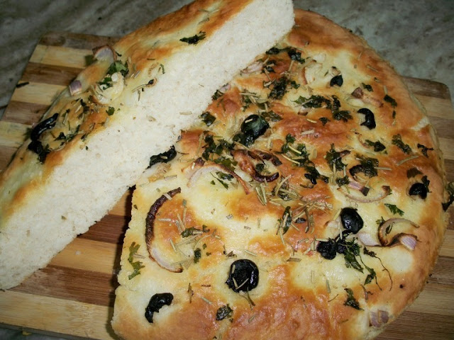 Focaccia Bread Flavoured with Rosemary,Onions and Olives - Yummy Tummy