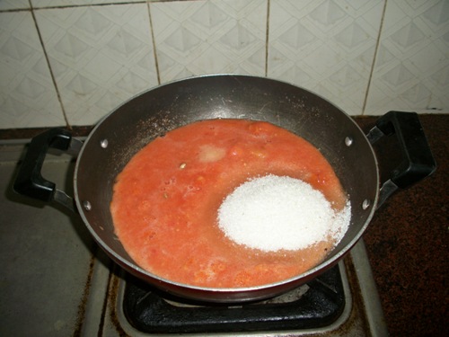 take tomato puree and sugar in kadai