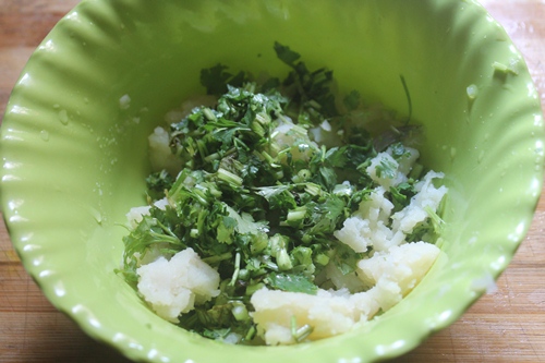 add coriander leaves and green chillies