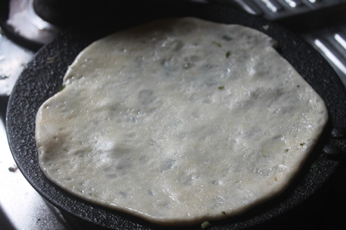 place kulcha on hot pan