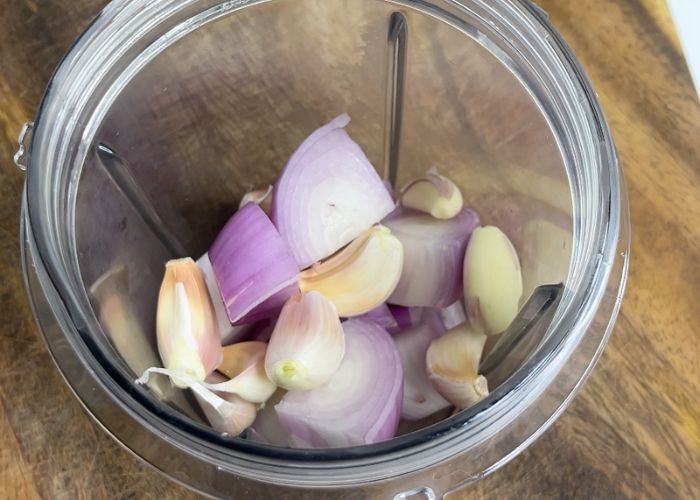 make marinade for chicken. Take onion garlic in a blender